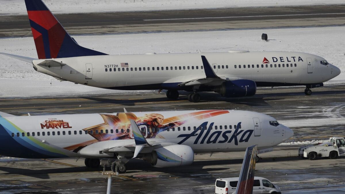 Delta and Alaska were among several airlines that experienced a system outage Monday.