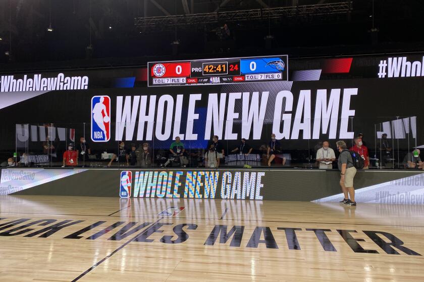 The Arena features "Black Lives Matter" painted on the court.