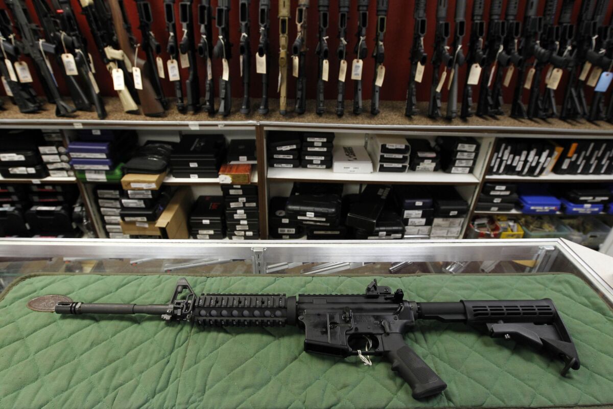 An AR-15-style rifle is displayed at an indoor range and gun shop in Colorado in 2012.