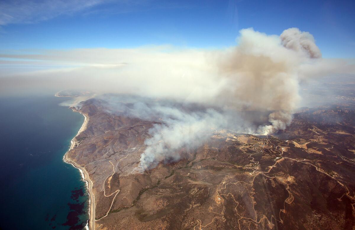 An aerial view of the Springs fire burning in the Santa Monica Mountains between Malibu and Newbury Park is shown.