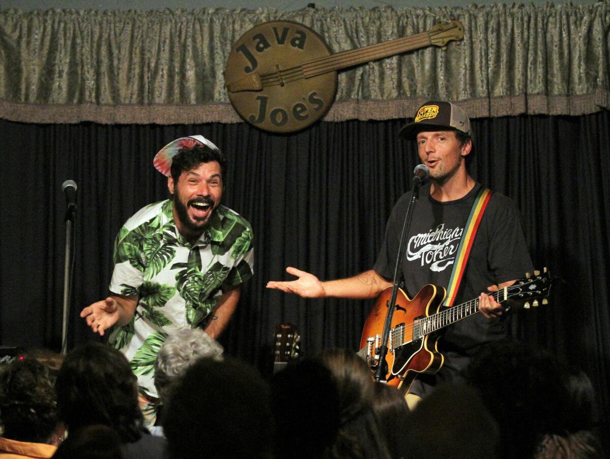 Billy Galewood, left, and Jason Mraz are shown on stage at Java Joe's