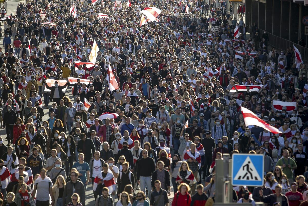 Protesters against President Alexander Lukashenko of Belarus march in Minsk.