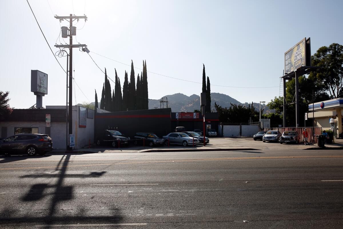 The building at 10243 N. Topanga Canyon Boulevard is currently an automotive sales lot and garages 