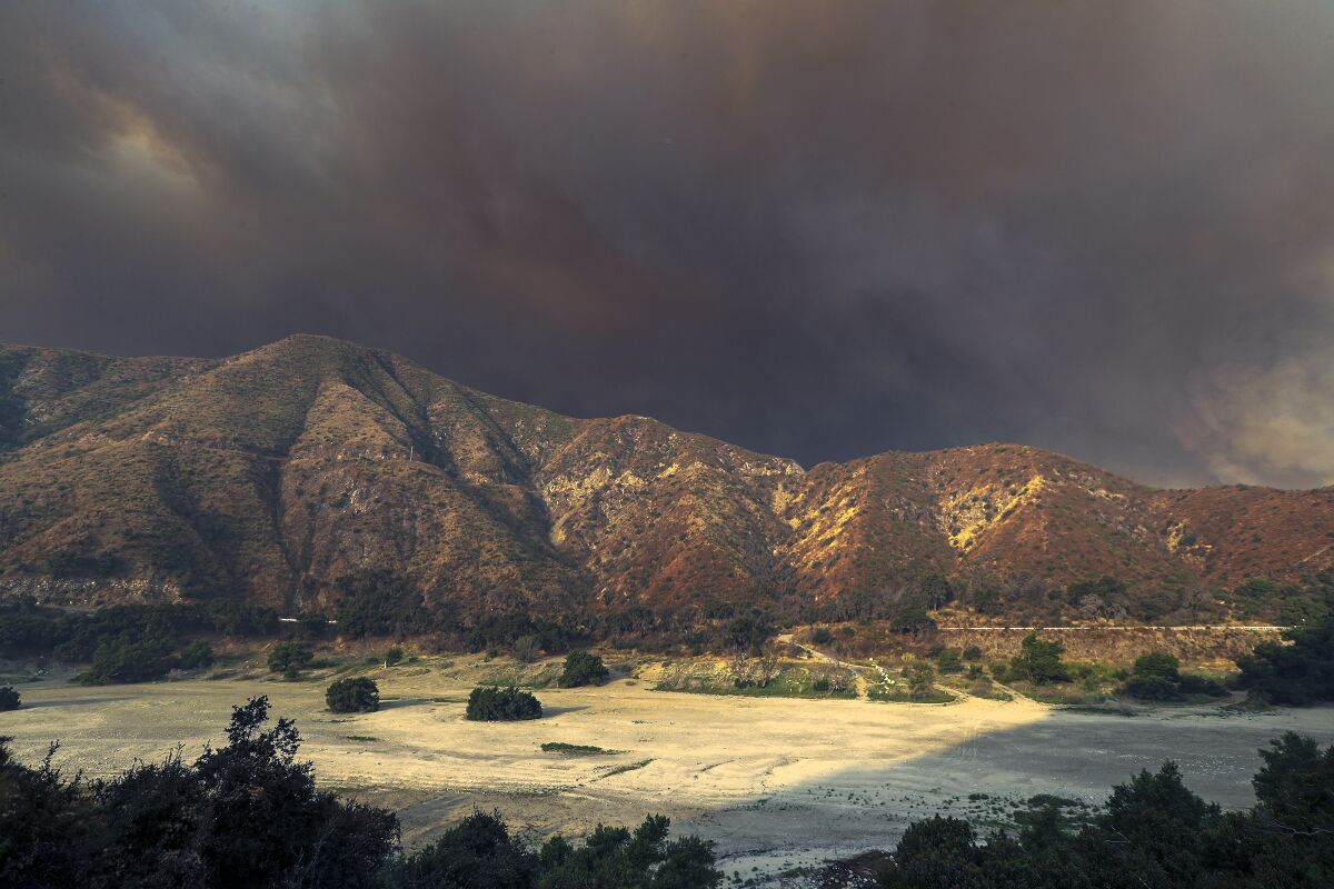 Smoke from the Bobcat fire rises in the San Gabriel Mountains.