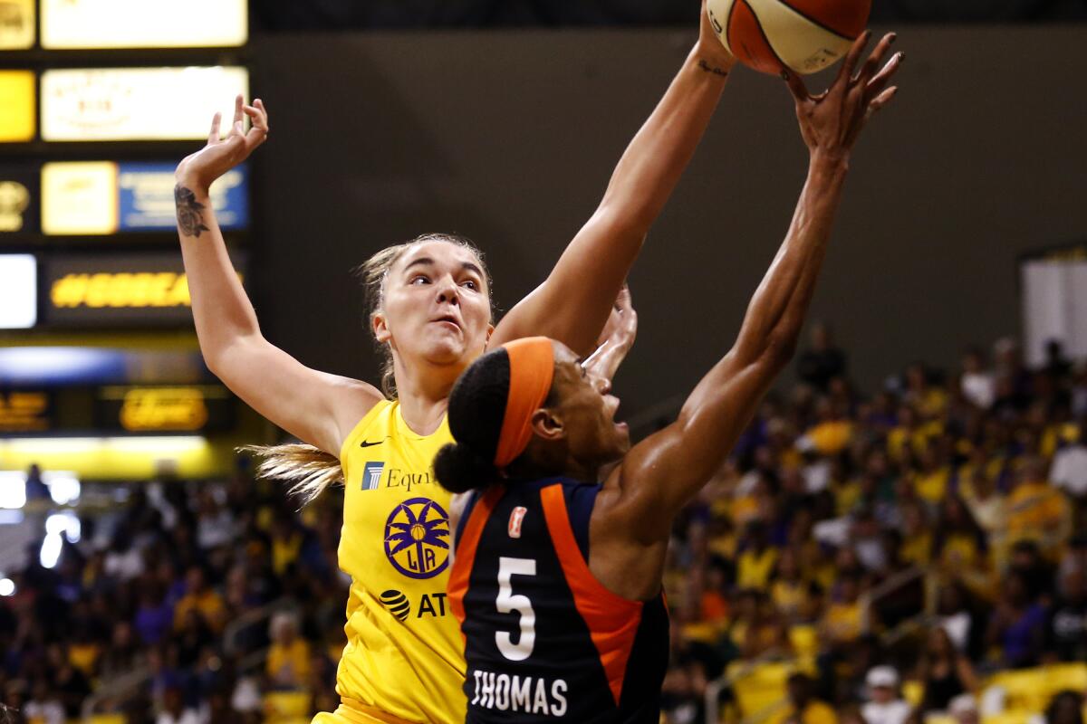 Sparks center Maria Vadeeva blocks a shot by Sun guard Jasmine Thomas during Game 3 on Sunday.