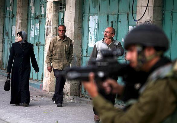 Israeli troops and Palestinian militants clash