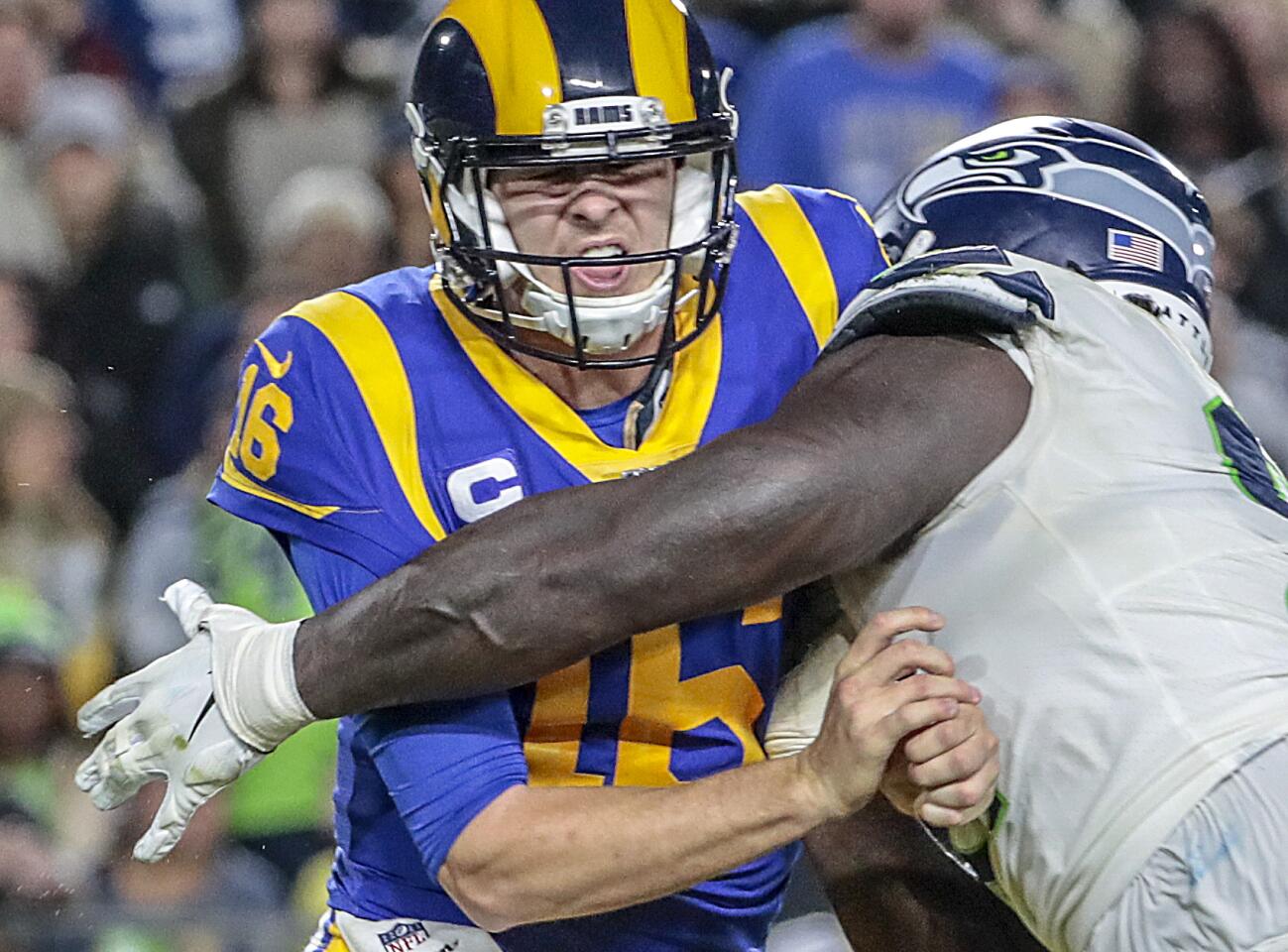 Rams quarterback Jared Goff is hit by Seattle Seahawks defensive tackle Jarran Reed.