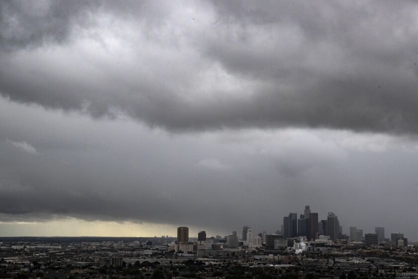 Storm clouds roll over the downtown Los Angeles skyscrapers during Thanksgiving week.