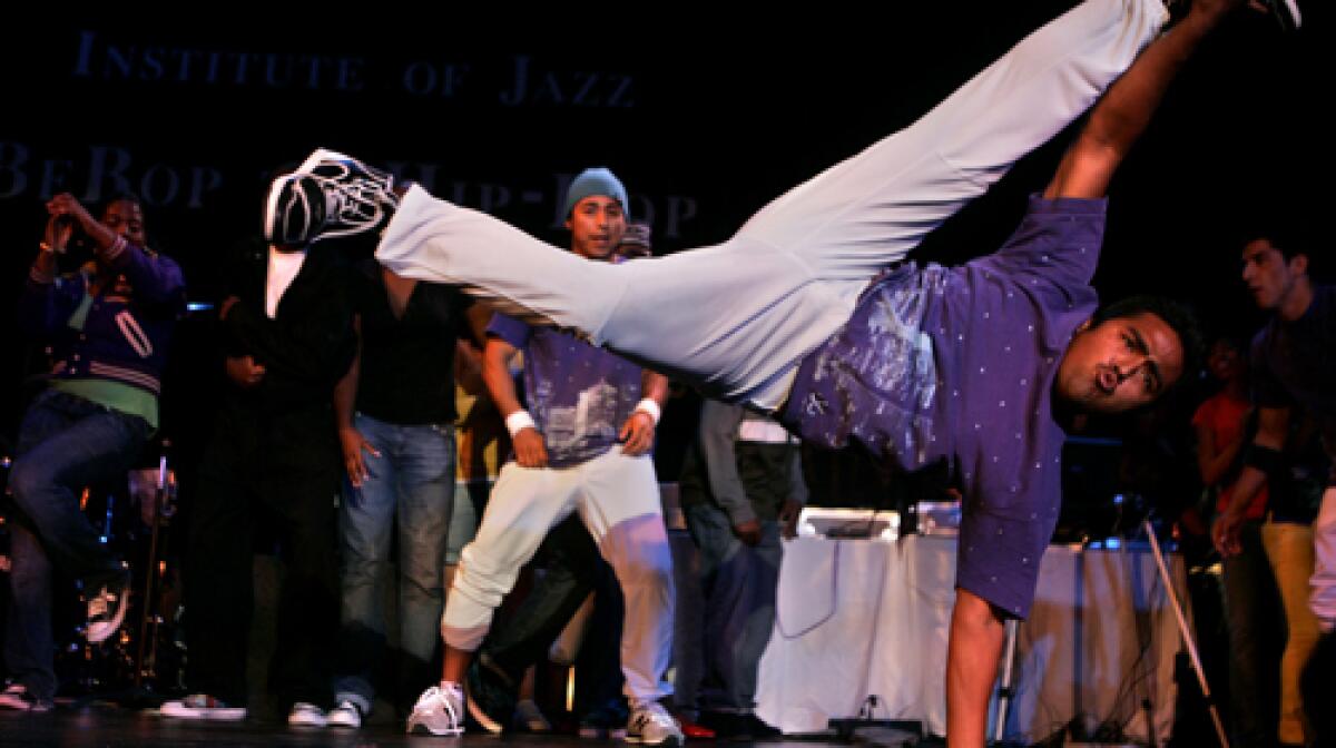 SHOWING OFF: Giovanni Avelar, foreground, and Carlos Ramos, center, break dance.