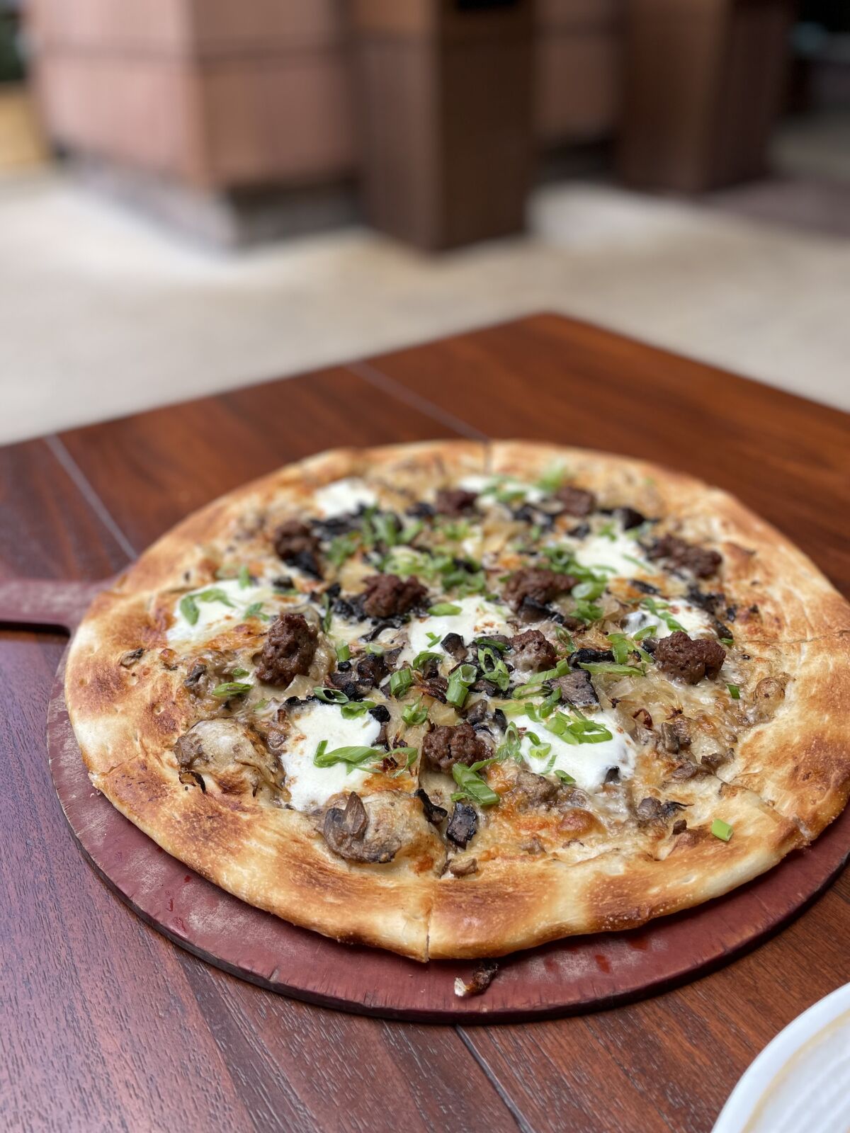 A forest mushroom Impossible Sausage pizza from the Craftsman Grill at Disney’s Grand Californian Hotel.