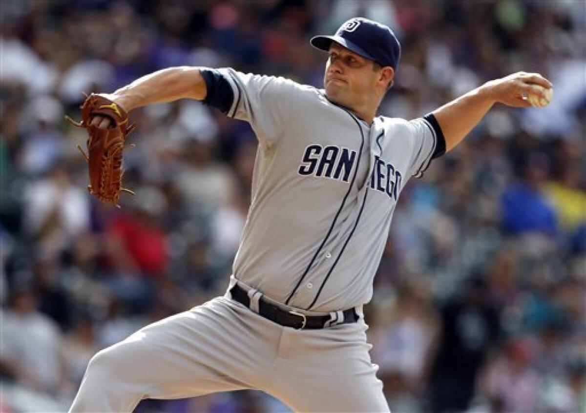 San Diego Padres starting pitcher Eric Stults works against the Colorado Rockies in the first inning of a baseball game in Denver, Saturday, June 8, 2013. (AP Photo/David Zalubowski)