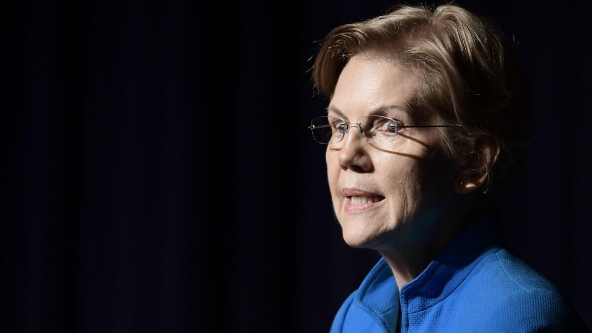 Sen. Elizabeth Warren said Tuesday that she was sorry she identified herself as a Native American for almost two decades.