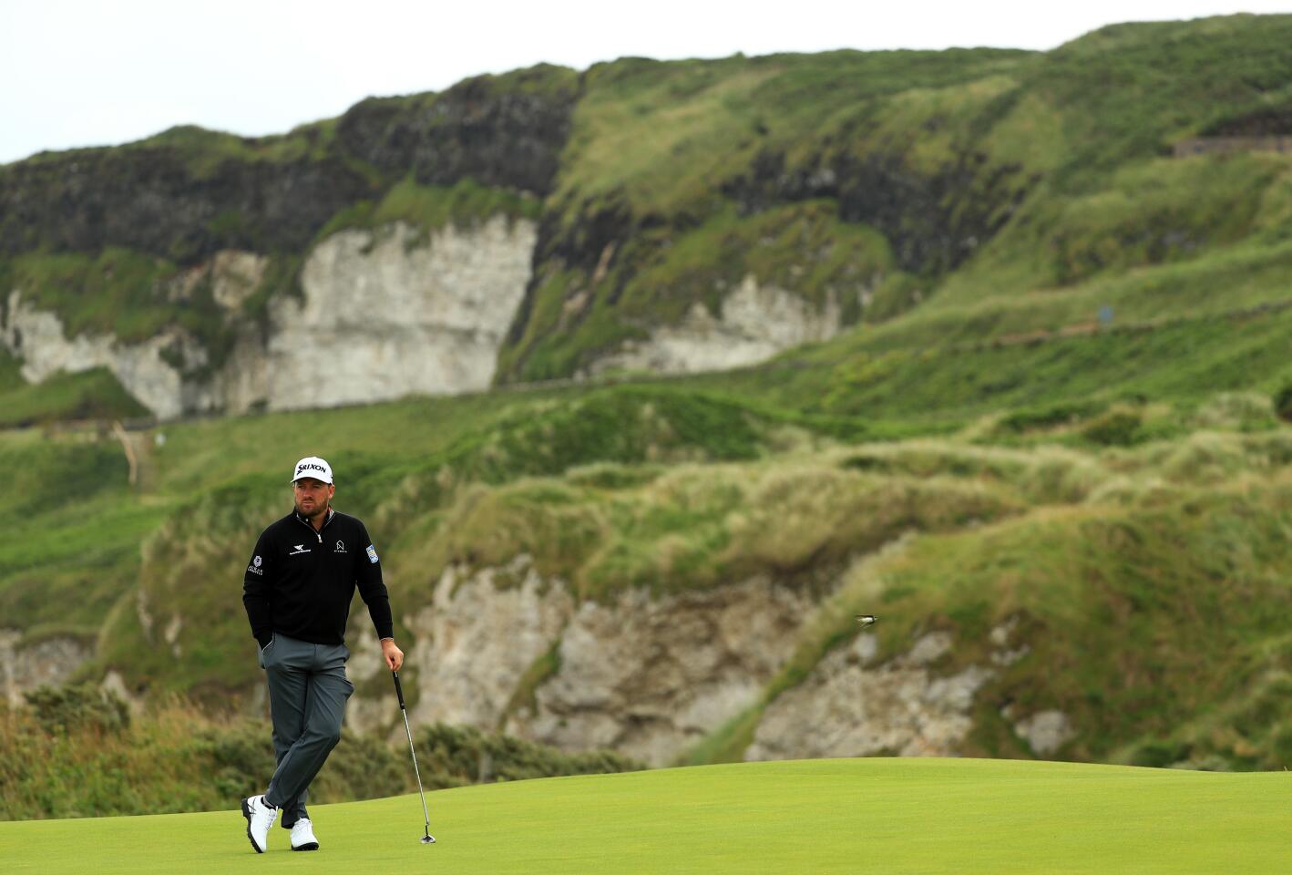 Graeme McDowell of Northern Ireland waits to play on the fifth green during the first round of the 148th Open Championship at Royal Portrush Golf Club in Northern Ireland.