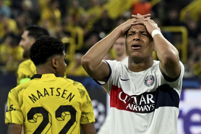 PSG's Mbappe reacts after a missed chance during the Champions League semifinal first leg soccer match between Borussia Dortmund and Paris Saint-Germain at Signal Iduna Park, Dortmundm Germany, Wednesday May 1, 2024. (Bernd Thissen/dpa via AP)