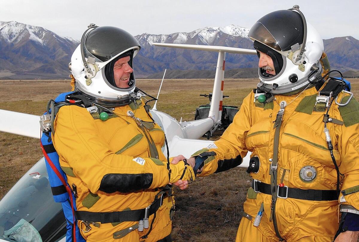 Billionaire adventurer-pilot Steve Fossett, left, and Einar Enevoldson shake hands after a test flight in 2002.