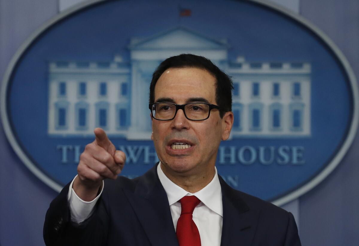 Treasury Secretary Steven Mnuchin speaks at a news briefing at the White House.