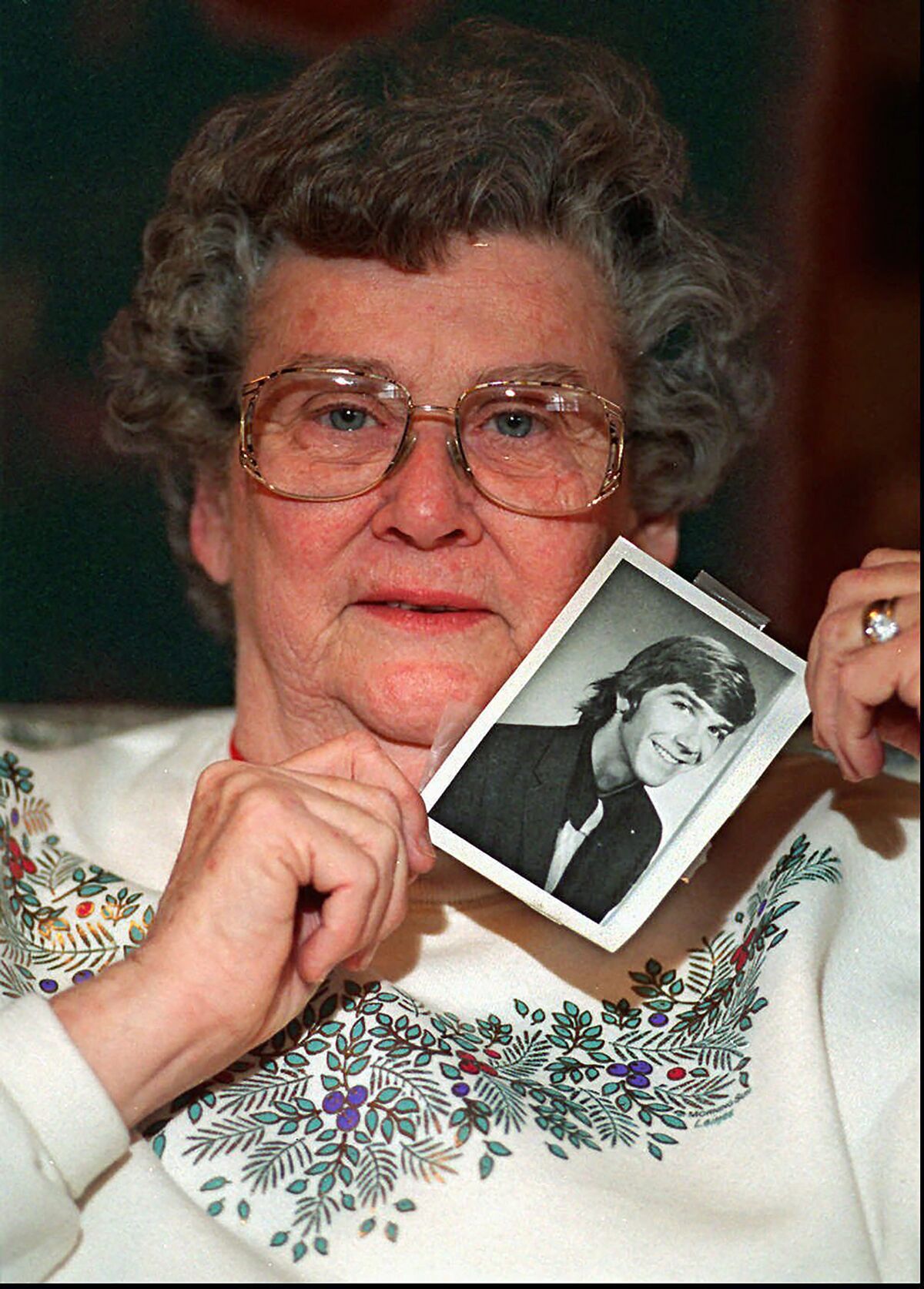 Louise Clinkscales holds a photo of her son Kyle Clinkscales at age 21 in this undated file photo. Investigators have discovered the 1974 Pinto a 22-year-old student was driving on his way back to Auburn University from Georgia when he disappeared more than 45 years ago, sheriff's officials announced Wednesday, Dec. 8, 2021. Kyle Clinkscales' car was pulled from a creek around Cusseta, Alabama, on Tuesday after a man called 911 to say he believed he had spotted a vehicle. (Renee Hannis/Atlanta Journal-Constitution via AP)