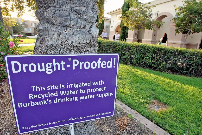 Signage outside of the Buena Vista branch of the library indicates the use of recycled water. Photographed on Wednesday, August 19, 2015. The city’s large water users such as parks, schools and studios have offset their reduced use of drinking water by dipping into the city’s recycled water supply for outdoor watering and air-conditioning systems that use water towers, but residents didn’t have that option — until now.