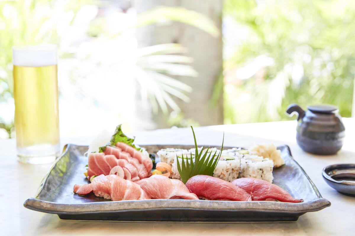 A platter full of sushi.
