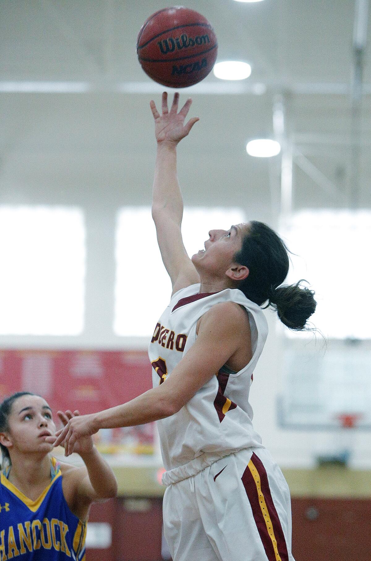 Glendale Community College's Vicky Oganyan shoots a reverse layup against Allan Hancock in a women's basketball game in the annual Vaquero basketball tournament at Glendale Community College on Wednesday, December 18, 2019. Oganyan is the long-time head coach of the Burroughs High School girls' basketball team and is playing for GCC while taking classes at GCC. Glendale won the game to improve to 10-1 on the season by defeating Allan Hancock 58-50.