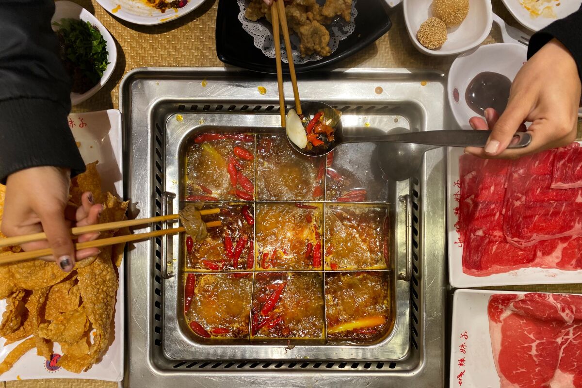 Shancheng Lameizi Hot Pot in San Gabriel serves Chongqing-style hot pot and offers a "Nine Boxes Spicy Pot" that allows you to cook different items in each box. 