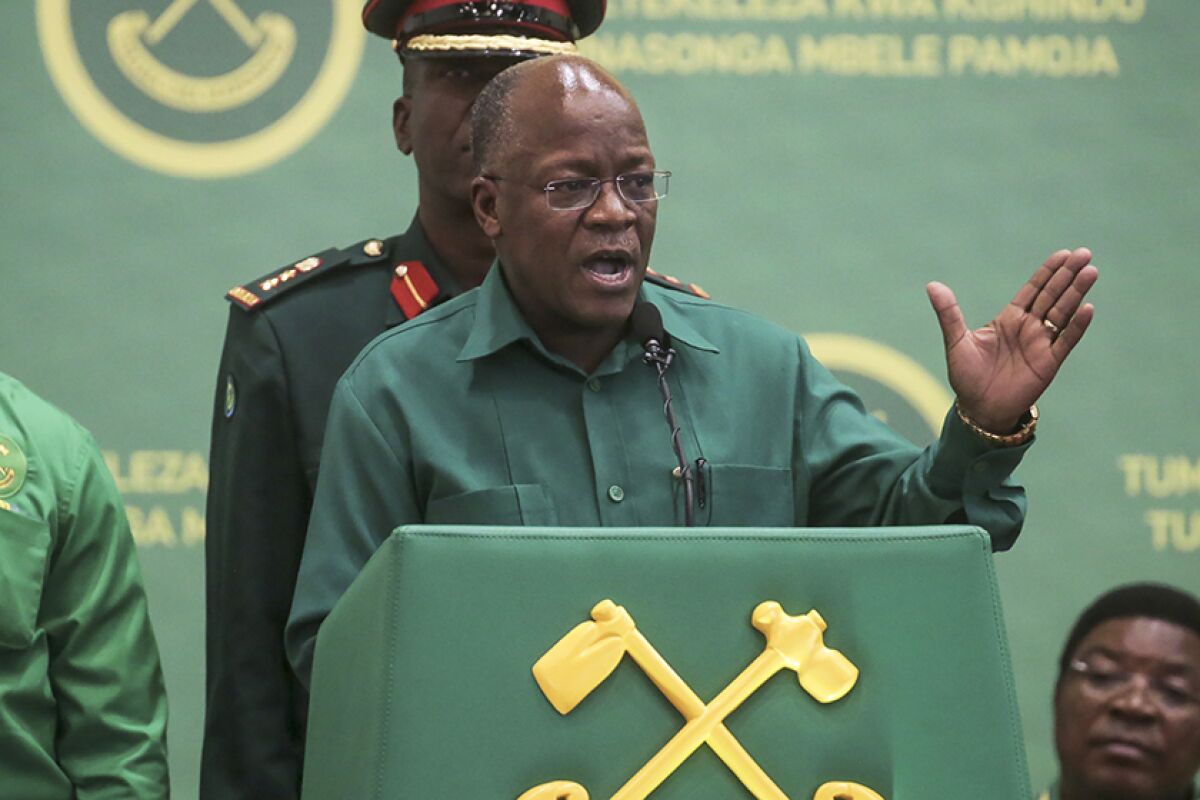 Tanzania's president speaks at a lectern.