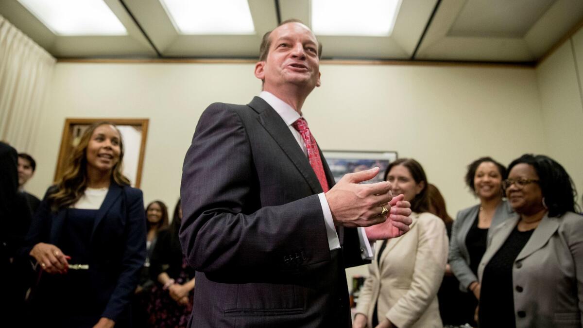 Labor Secretary Alexander Acosta greets employees after being sworn in to office on April 28.