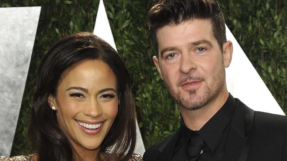 Paula Patton and Robin Thicke are seen in early 2013.
