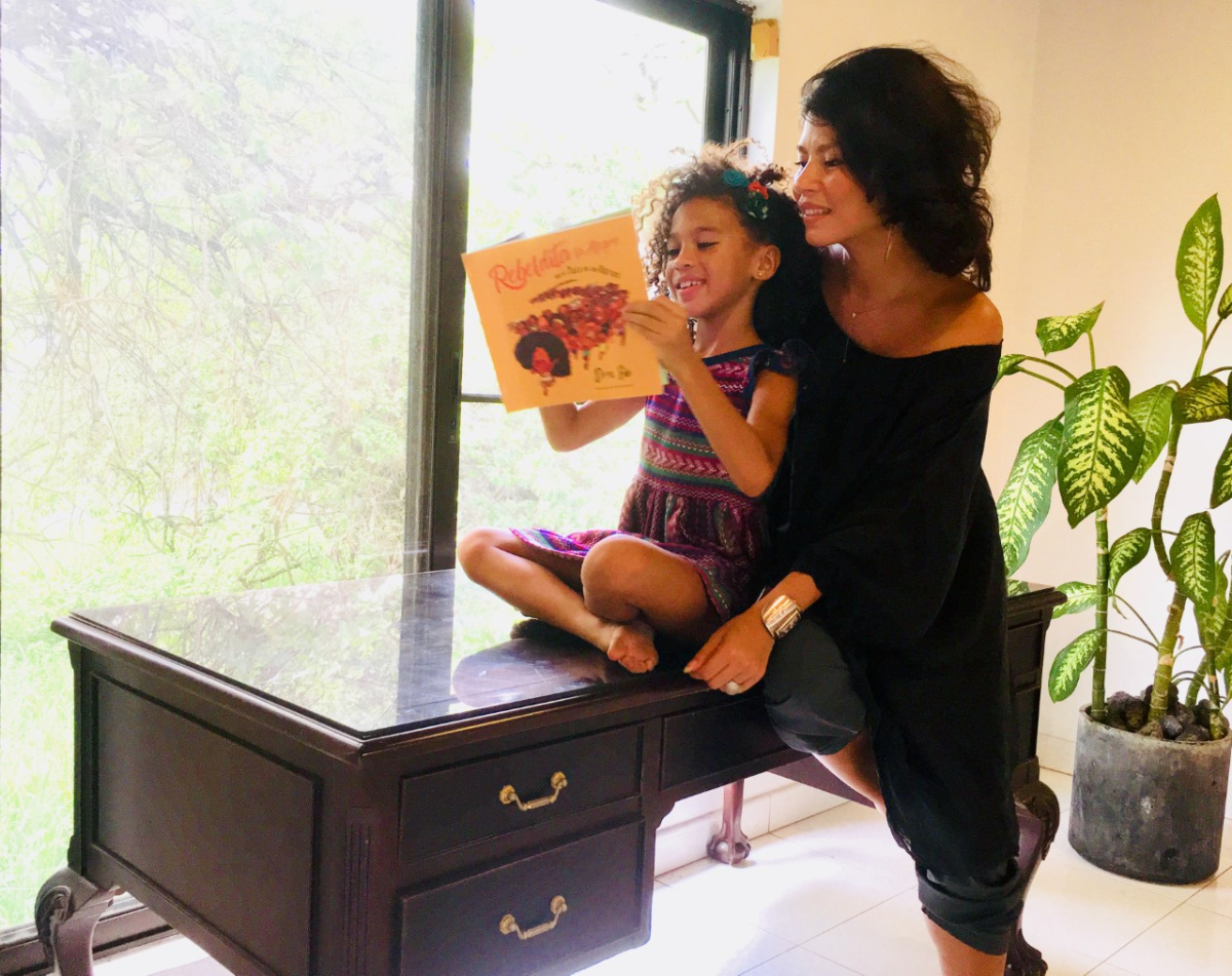 A child and her mother read