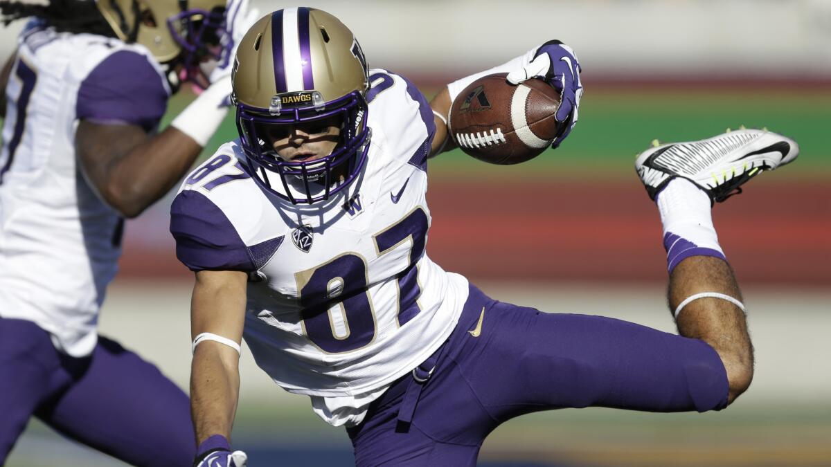 Washington receiver Dante Pettis carries the ball during the Huskies' win over California on Saturday.