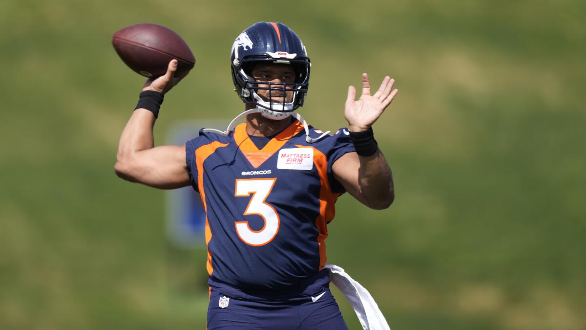 Denver Broncos quarterback Russell Wilson takes part in drills during minicamp in April. 