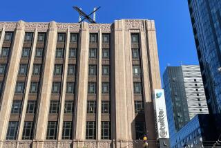 FILE - A large, metal "X" sign is seen on top of the downtown building that housed what was once Twitter, now rebranded by its owner, Elon Musk, in San Francisco, Friday, July 28, 2023. Musk said Thursday, Aug. 31, that his social network X, formerly known as Twitter, will give users the ability to make voice and video calls on the platform. (AP Photo/Haven Daley, File)