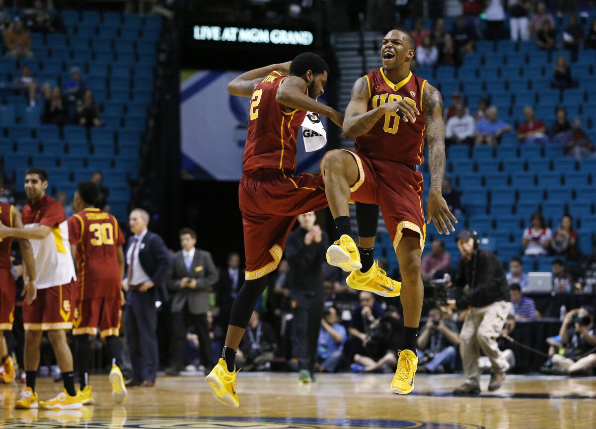 USC forwards Malik Martin and Darion Clark celebrate during the Trojans' come-from-behind 67-64 victory over Arizona State in the Pac-12 tournament.