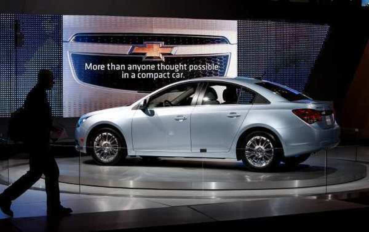 The Chevrolet Cruze on display at the 2010 Los Angeles Auto Show. Fluids dripping on the Cruze engine's shield or other hot surfaces could catch fire, prompting GM to recall the vehicles.