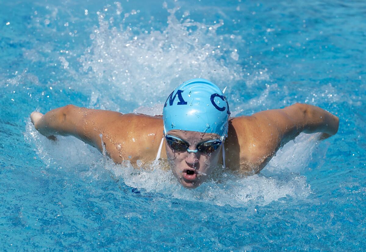 Corona del Mar's Maggie Schalow swims the butterfly leg of the 200 medley relay during Tuesday's meet. 