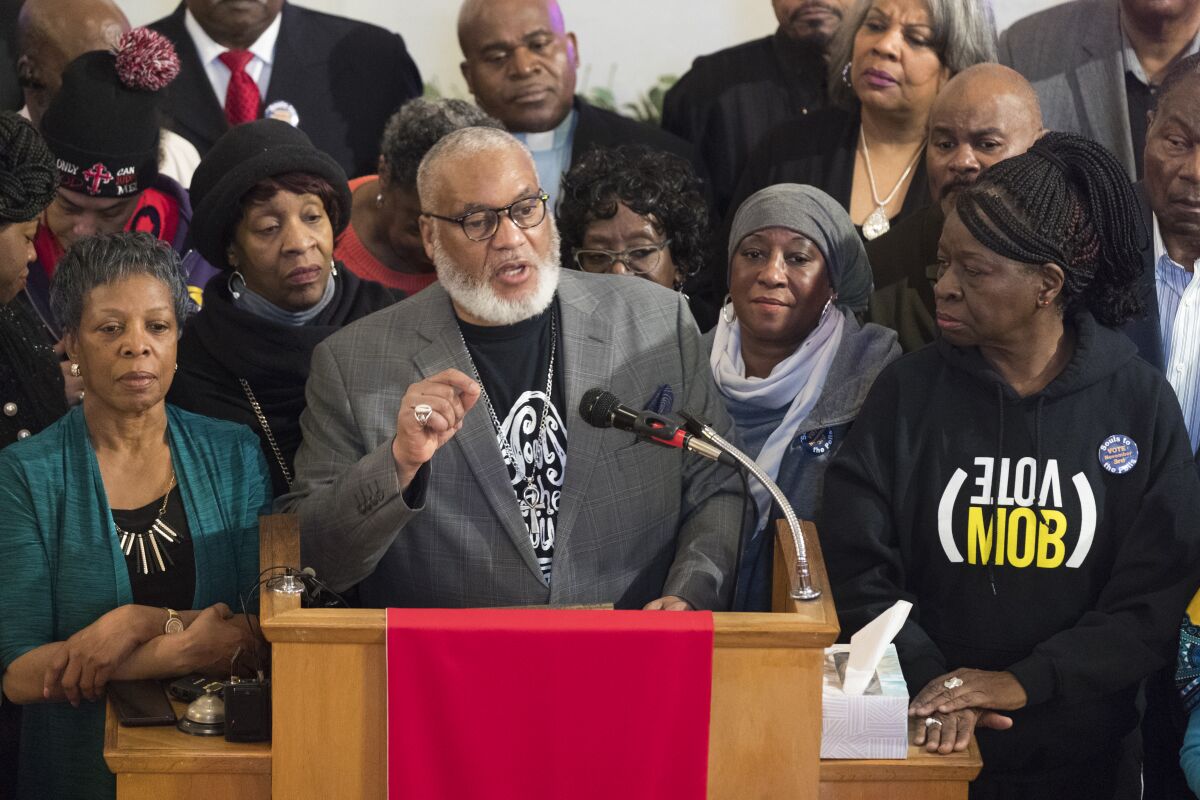 The Rev. Greg Lewis leads a Souls to the Polls rally at New Holy Ghost Tabernacle Baptist Church in Milwaukee. 