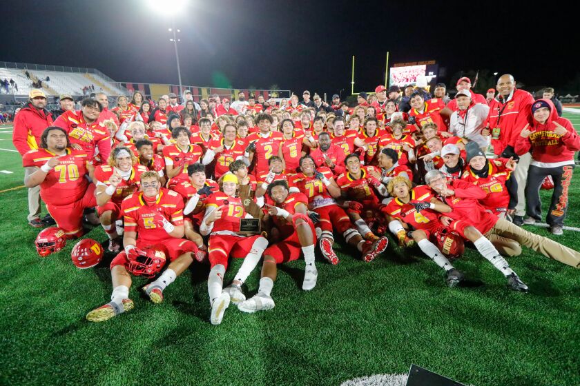 The Cathedral Catholic Dons celebrate a CIF State victory over the Folsom Bulldogs. The Dons won the contest 33-21