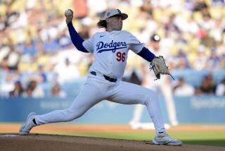 Los Angeles Dodgers starting pitcher Landon Knack throws during the first inning.