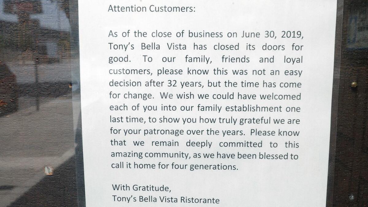 A notice in the menu case at Tony's Bella Vista Ristorante informing customers that the eatery is closed.