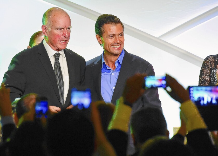 President Enrique Peña Nieto and Gov. Jerry Brown on Monday at the Millennium Biltmore Hotel in L.A. A good relationship with Peña Nieto and Mexico could pay political dividends for the governor, who is running for reelection in November.