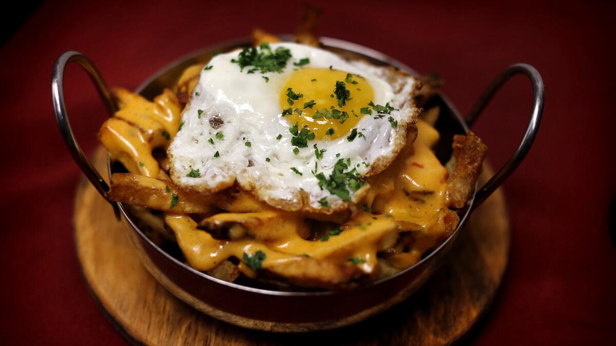 The Benedict fries from Nighthawk Breakfast Bar are made with French fries, a gooey smoked paprika cheese Hollandaise sauce and a fried egg. Nighthawk is opening locations in Venice and in Koreatown in August.