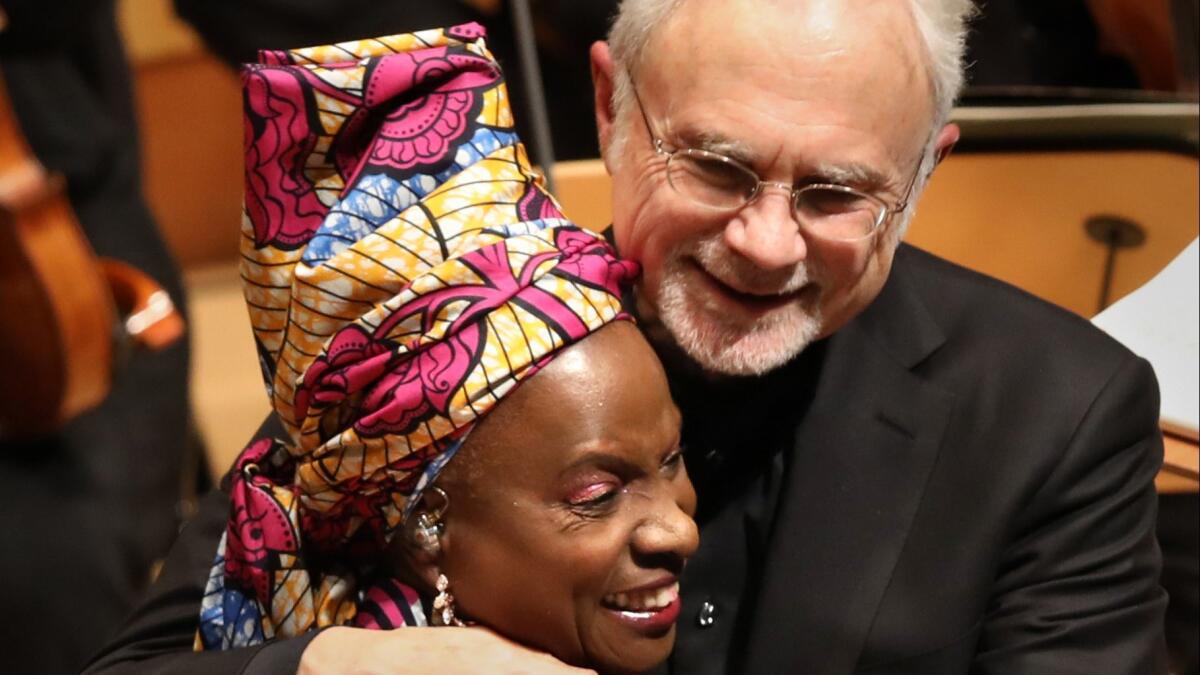 Singer Angèlique Kidjo with conductor John Adams at Disney Hall, where the two helped to premiere Philip Glass' Symphony No. 12 ("Lodger").