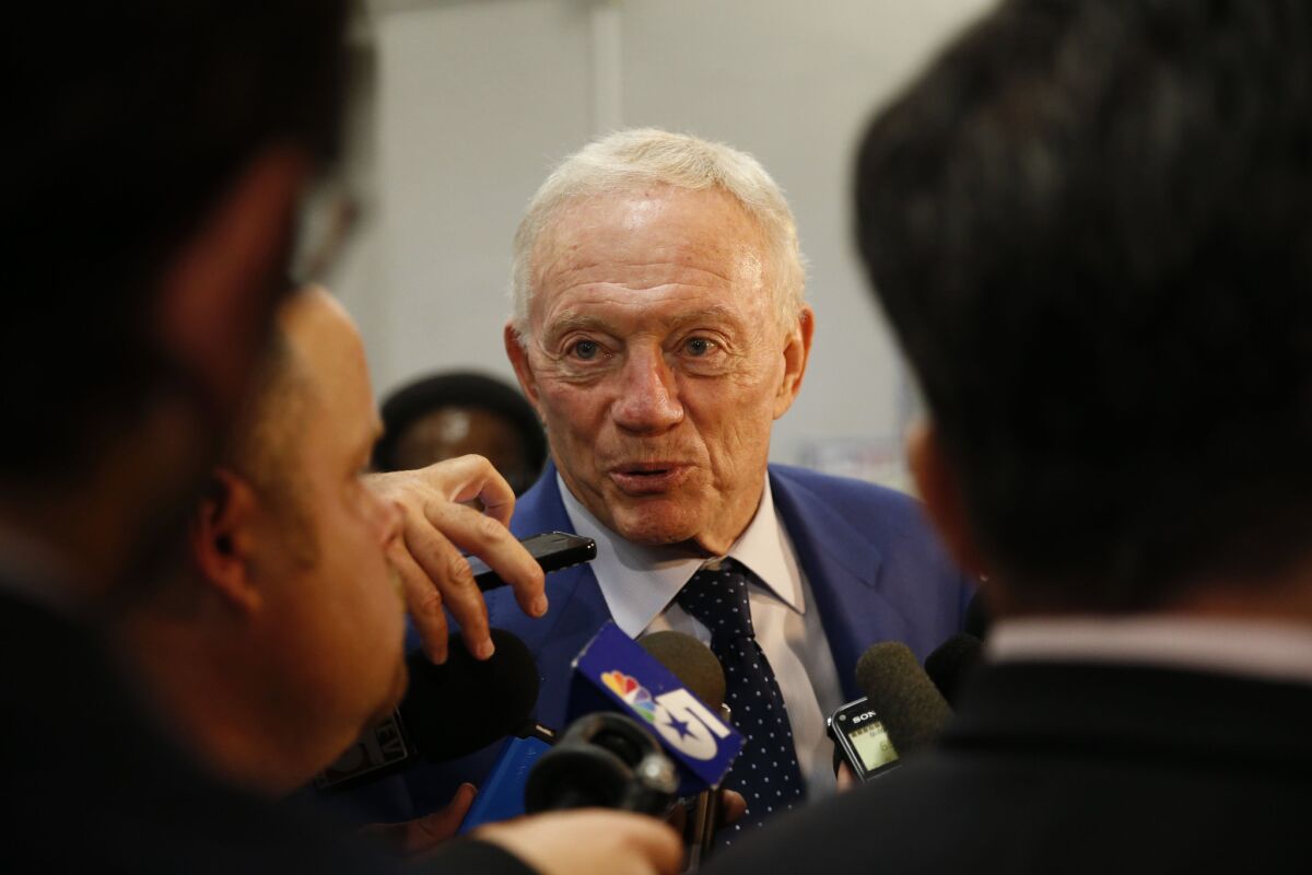 Cowboys owner Jerry Jones talks to reporters during a post-game interview after a loss to the Saints.