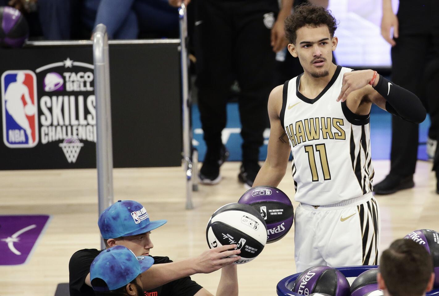 Hawks guard Trae Young acknowledges the crowd during the skills competition.