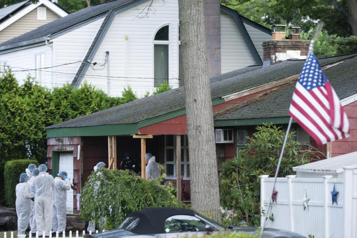 Crime lab officers at a slaying suspect's house in Massapequa, N.Y.