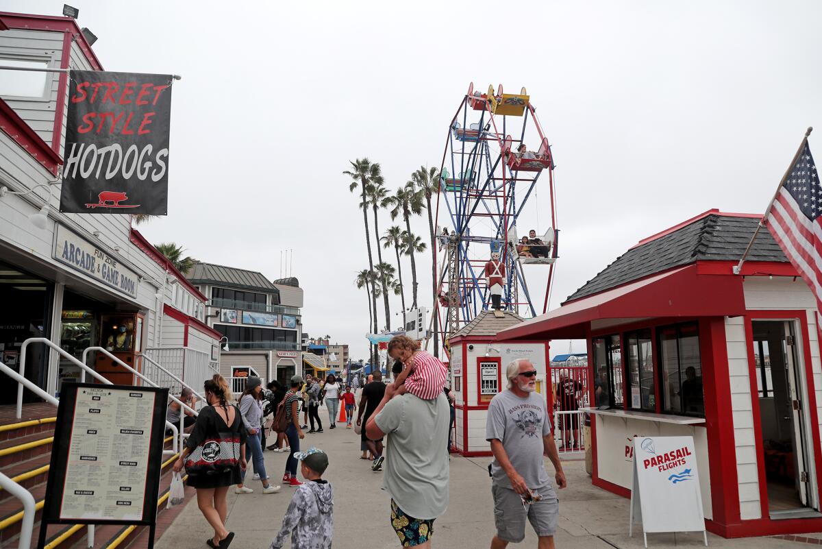 Visitors at the Balboa Fun Zone in Newport Beach on Wednesday.