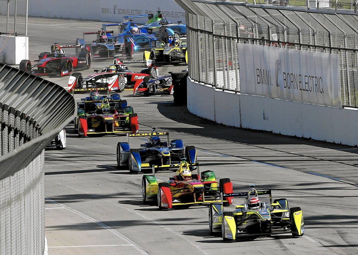 Nelson Piquet Jr. of Brazil leads the pack at the start of last year’s inaugural Formula E race in Long Beach, which he won. Many spectators were surprised at how relatively quiet the cars were.