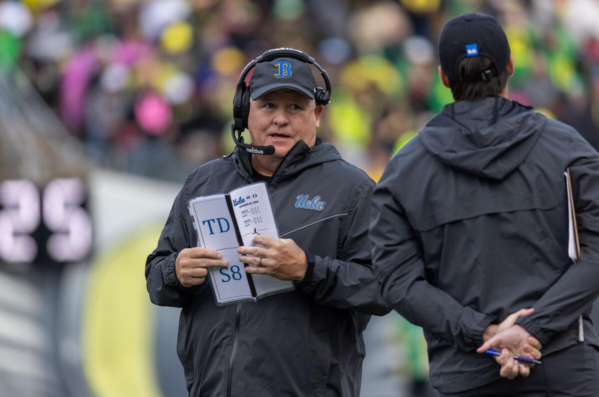 UCLA coach Chip Kelly stands on the sidelines during the first half against the Oregon Ducks.