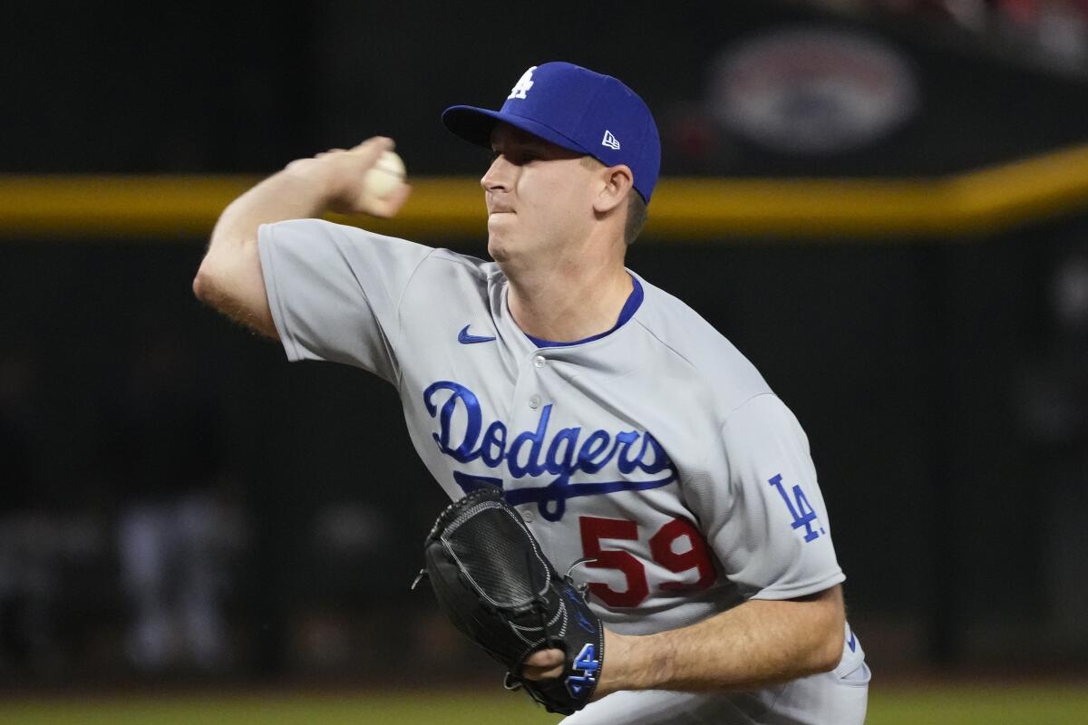 Dodgers relief pitcher Evan Phillips throws during the ninth inning of a 5-2 win over the Arizona Diamondbacks.