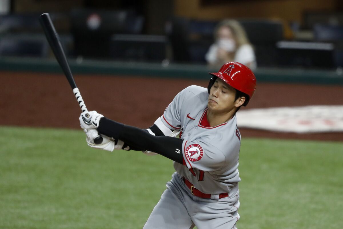 The Angels' Shohei Ohtani swings at a pitch in the sixth inning Aug. 8, 2020.